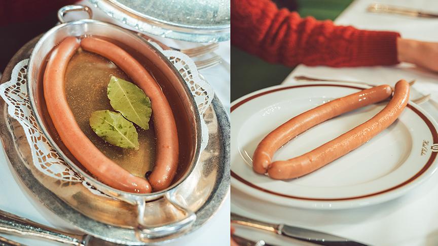 Im berühmten Hotel Sacher werden Silvia Schneider die berühmten Sacherwürstel serviert.