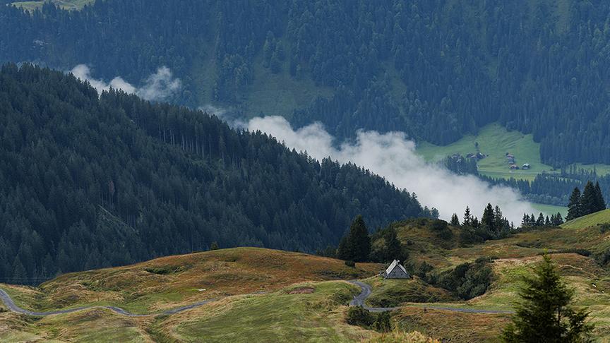 Silvia flies into the valley on a paraglider